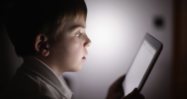 child using tablet growing up with technology