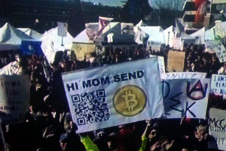 fan holding sign espn racks 25000 bitcoin donations hi mom send