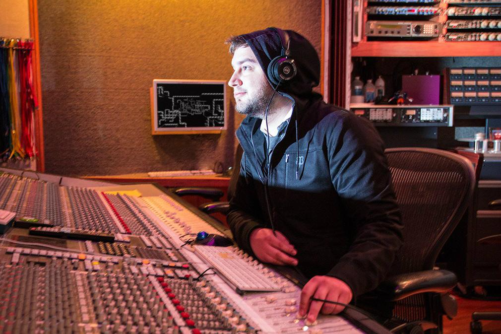 put headphones on over this hoodie made of speaker fabric audio engineer board