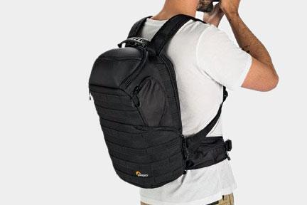 A close up of a person wearing a Lowepro ProTactic 350 AW Camera and Laptop Backpack.