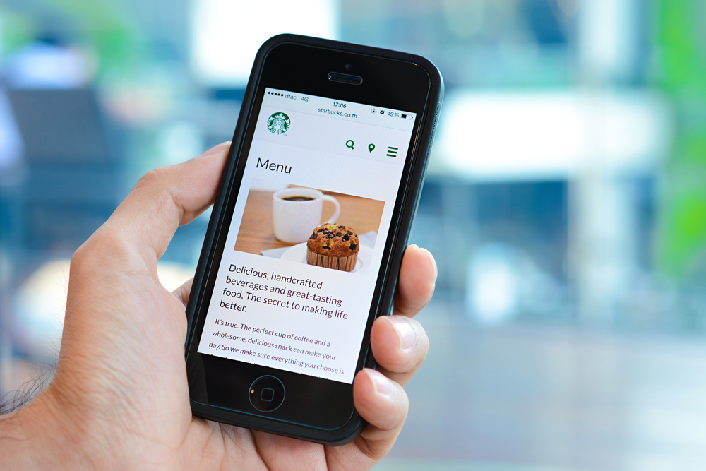 starbucks mobile ordering 7400 stores version 1443666562 phone menu shutterstock 301425419