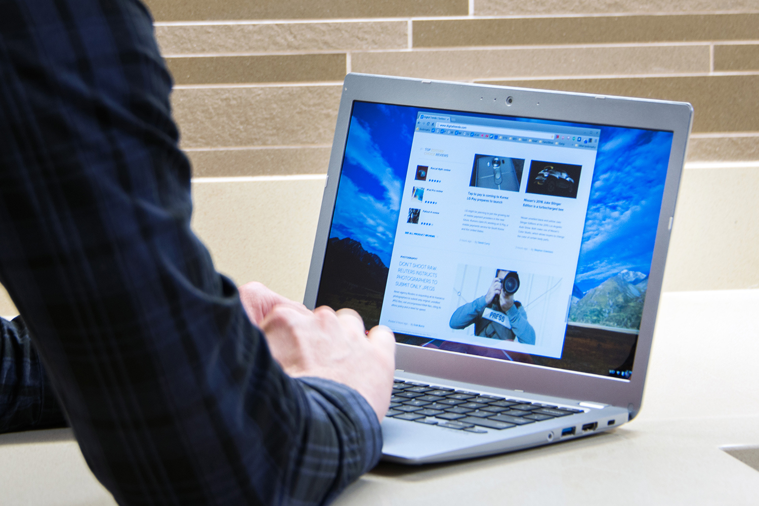 A person working on a Toshiba Chromebook.