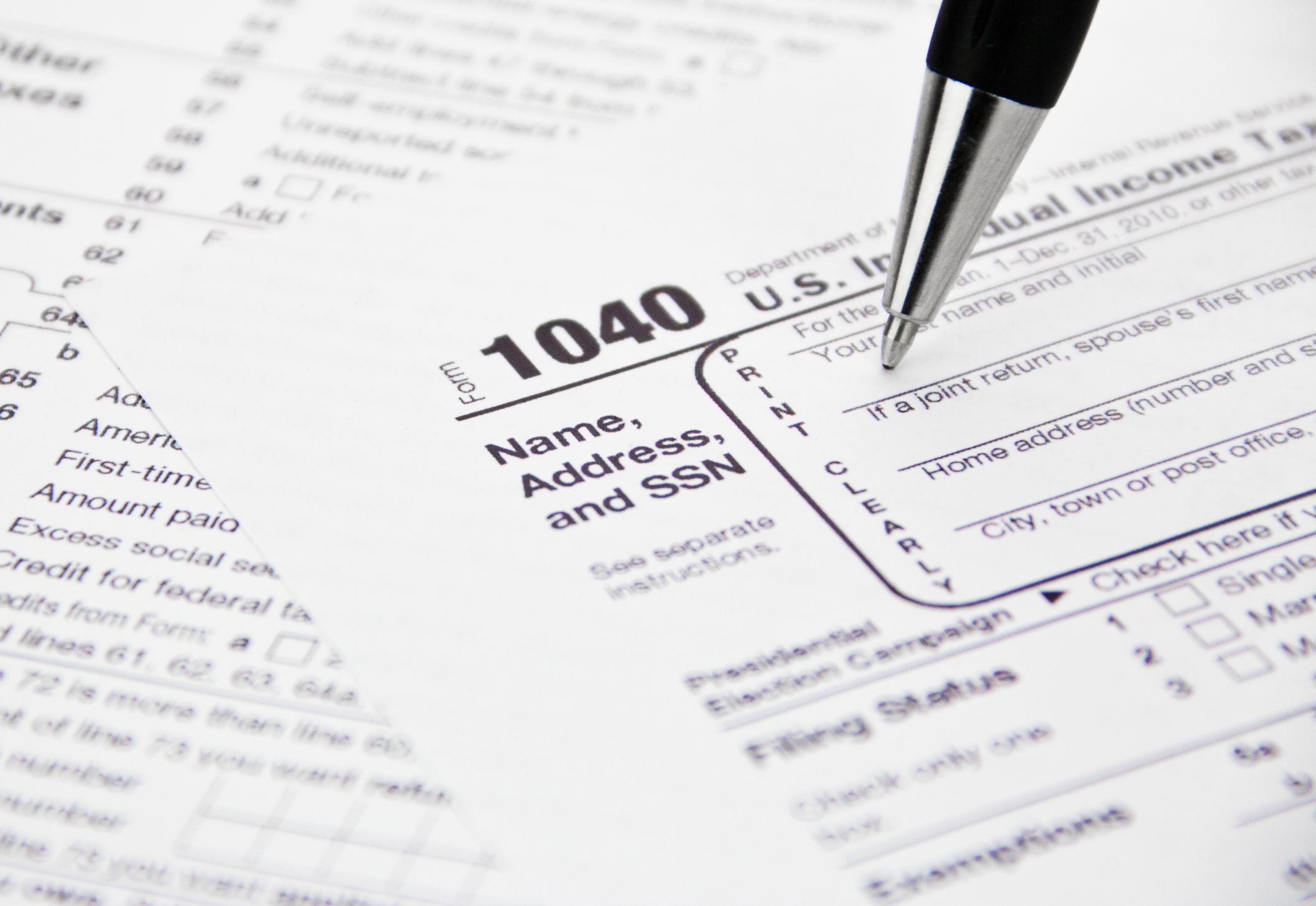 fake irs emails are delivering dangerous new malware this tax season 1040 form being filled out