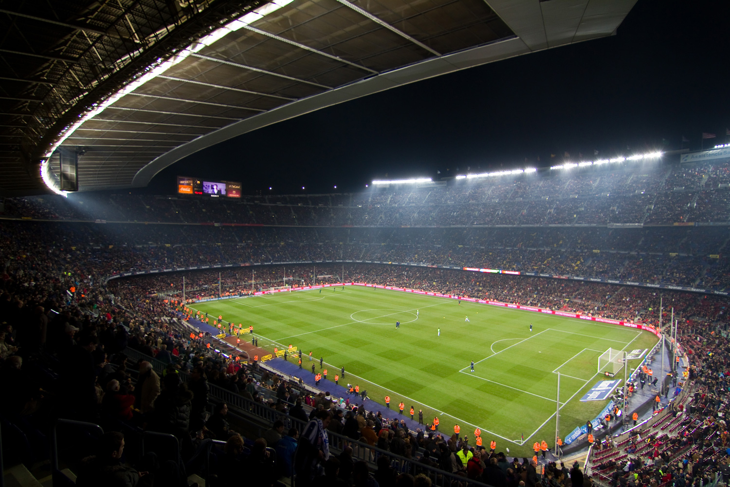 A soccer stadium with a view from the crowd.