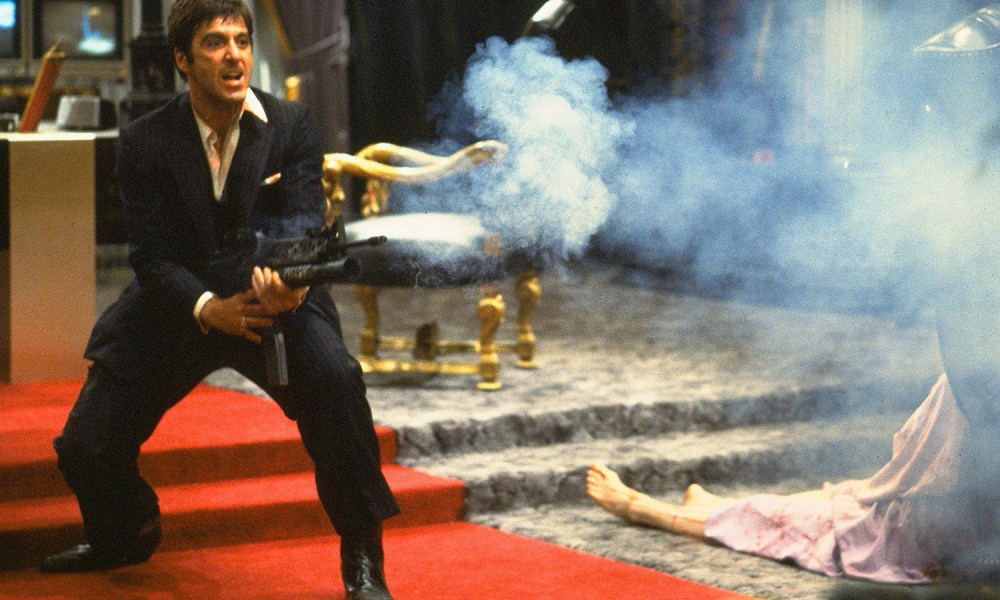 Al Pacino holding a gun in Scarface.