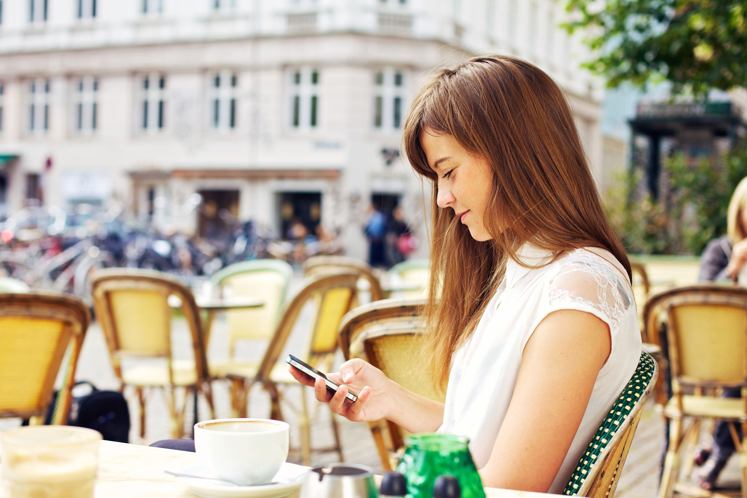 eno capital one woman texting on smartphone