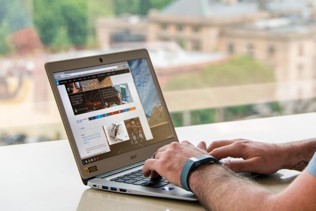 A person using an Acer Chromebook 14.