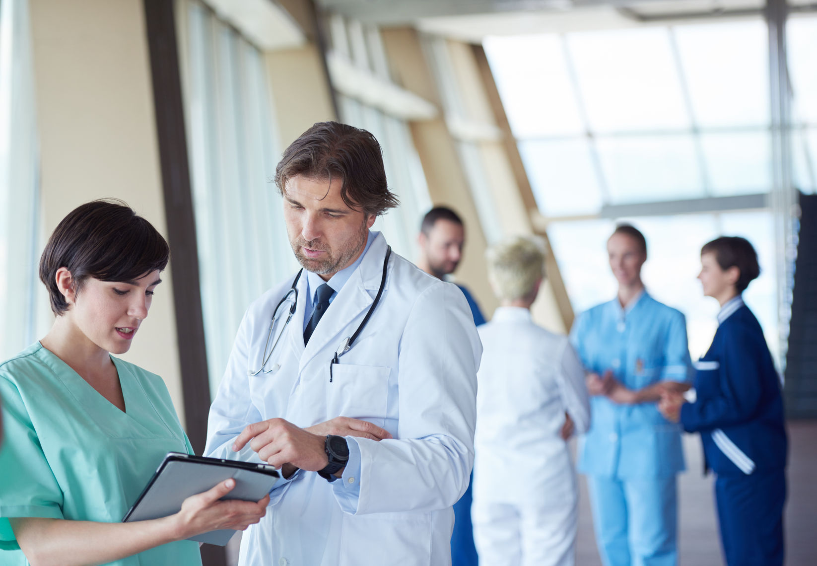 roup of medical staff at hospital, doctors team standing together