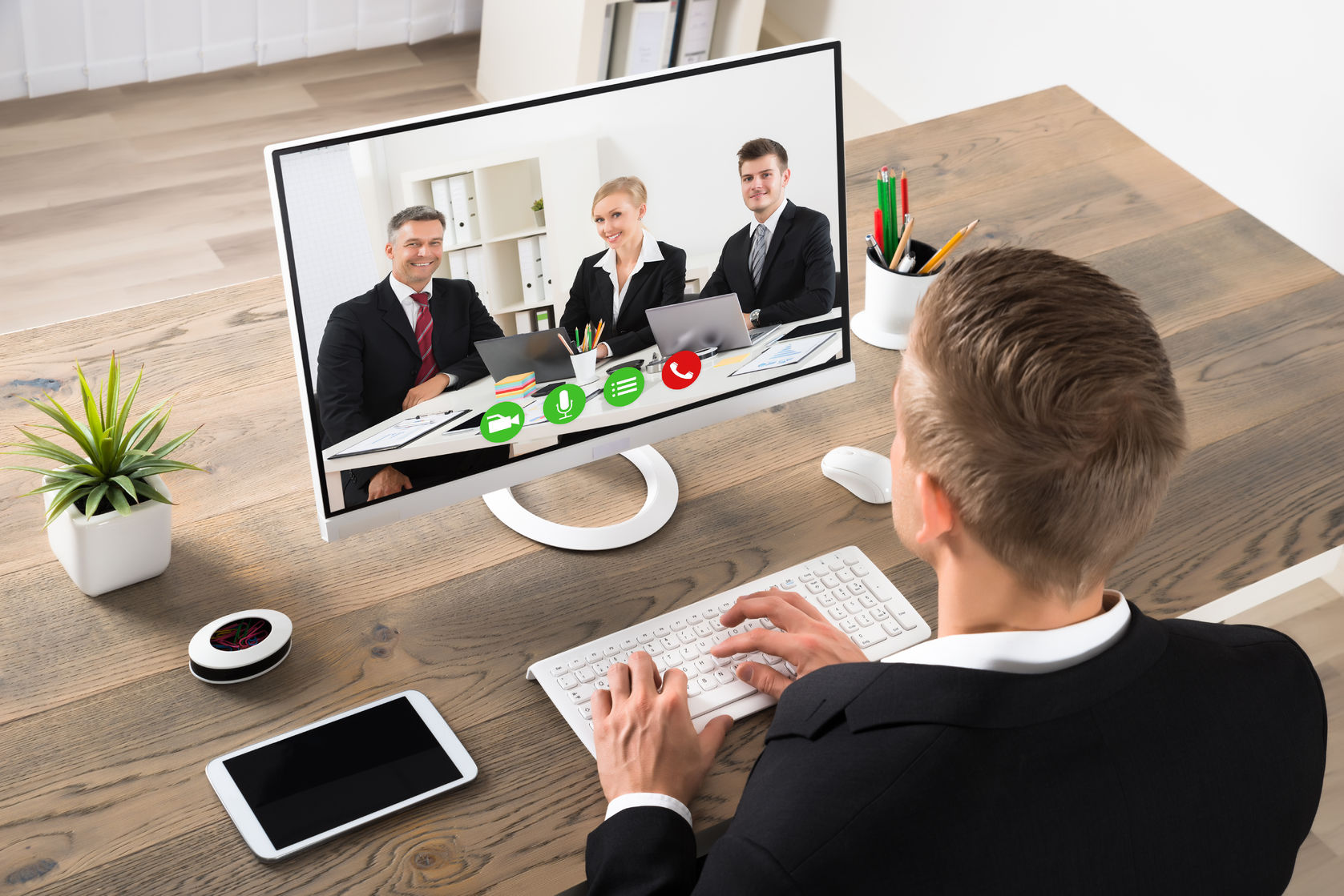 skype video calls appearance barrier 54885605  young businessman attending videoconference on computer at office