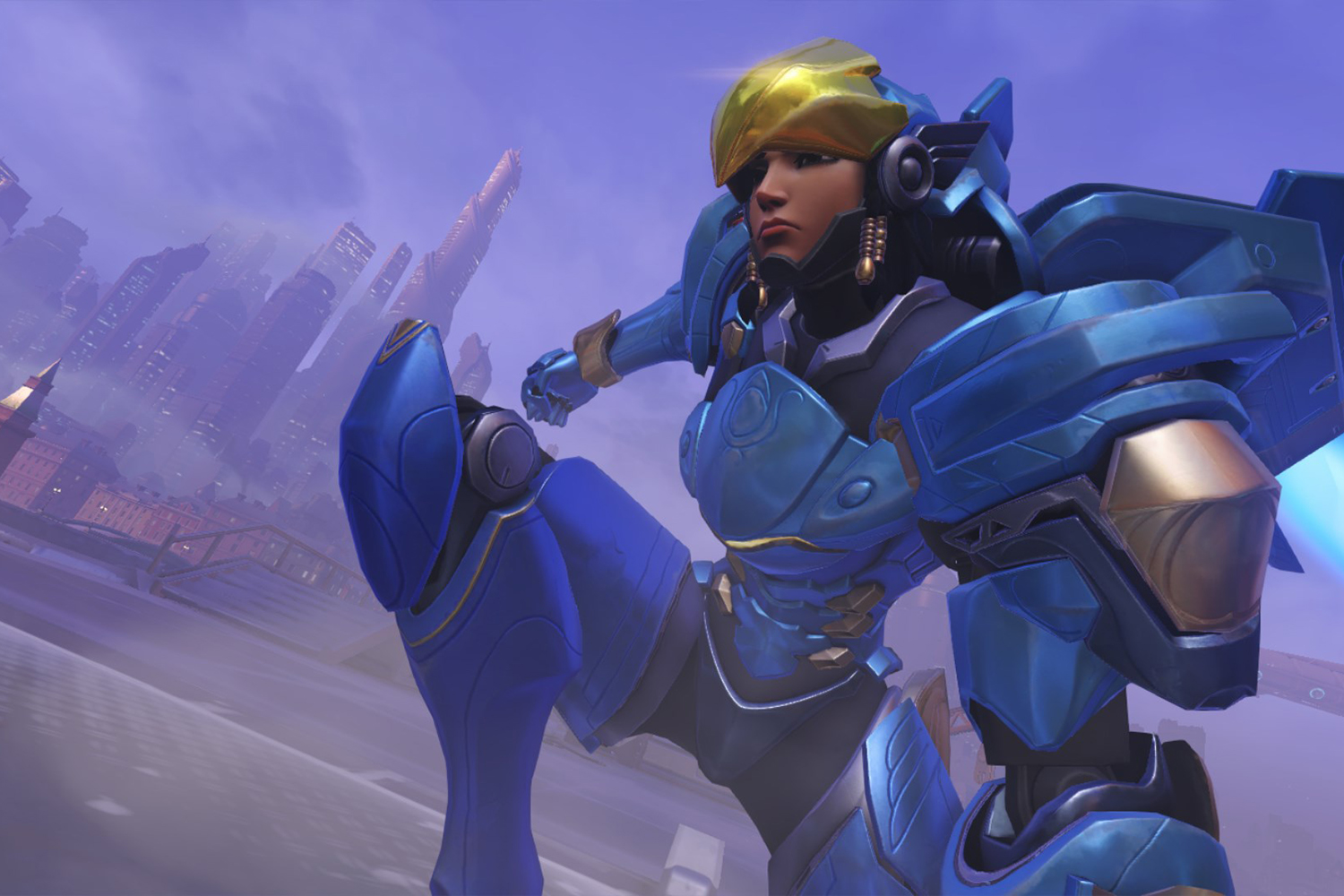 Pharah kneeling in blue armor.