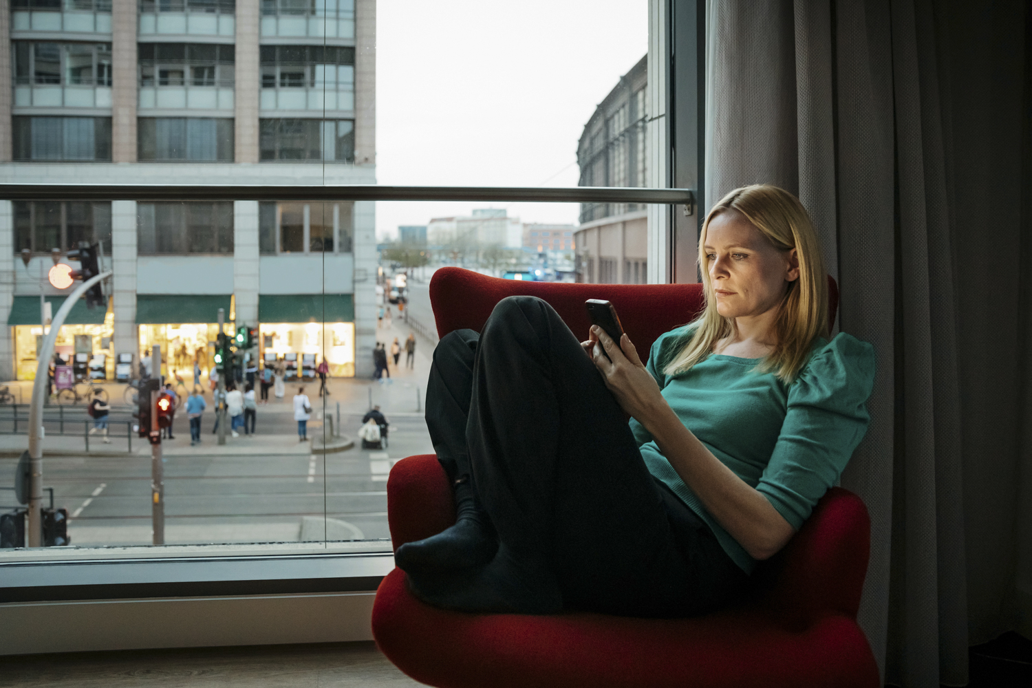 Woman using phone on 4G speeds