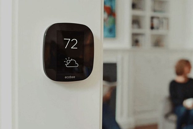 Ecobee4 smart thermostat mounted near living room.