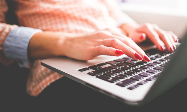 Person typing on a laptop.