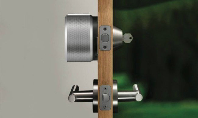Side profile view of August smart lock on a door.
