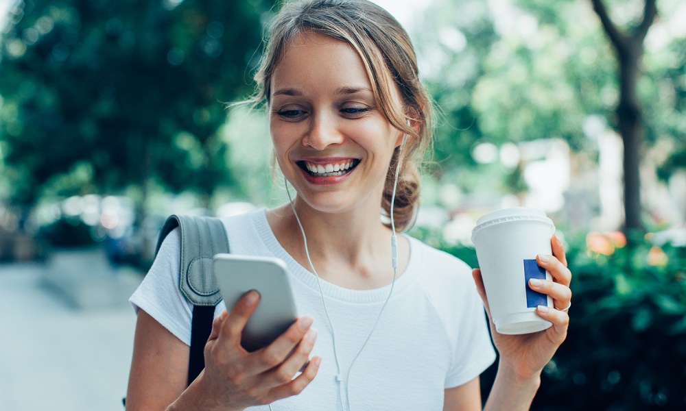 Woman looking at iPhone.