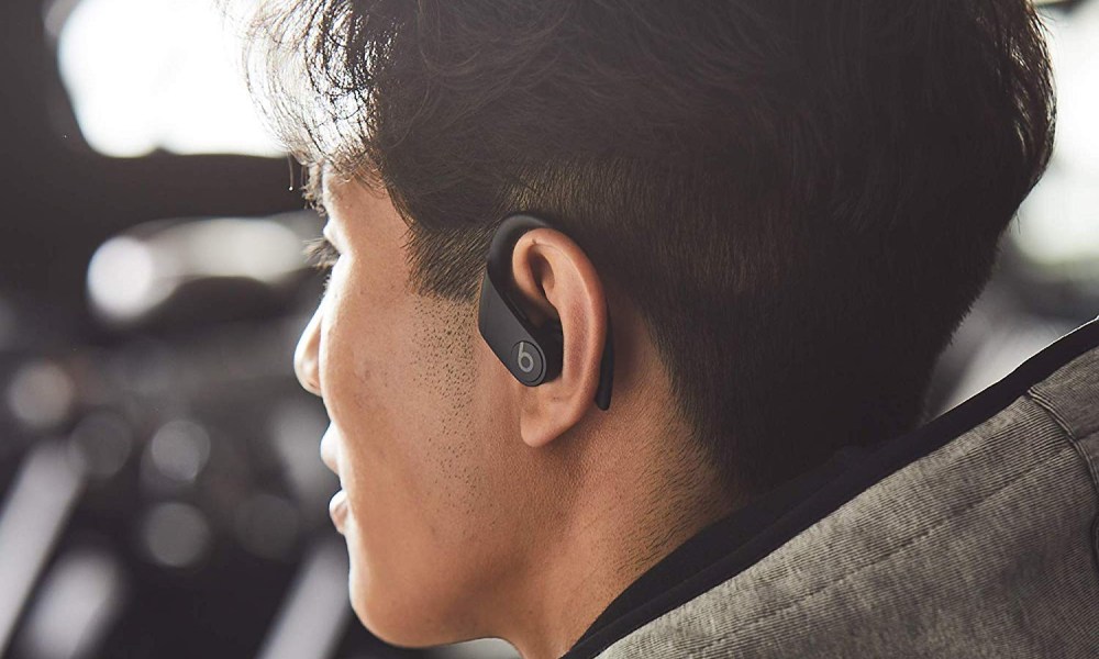 A person wearing the Beats Powerbeats Pro.