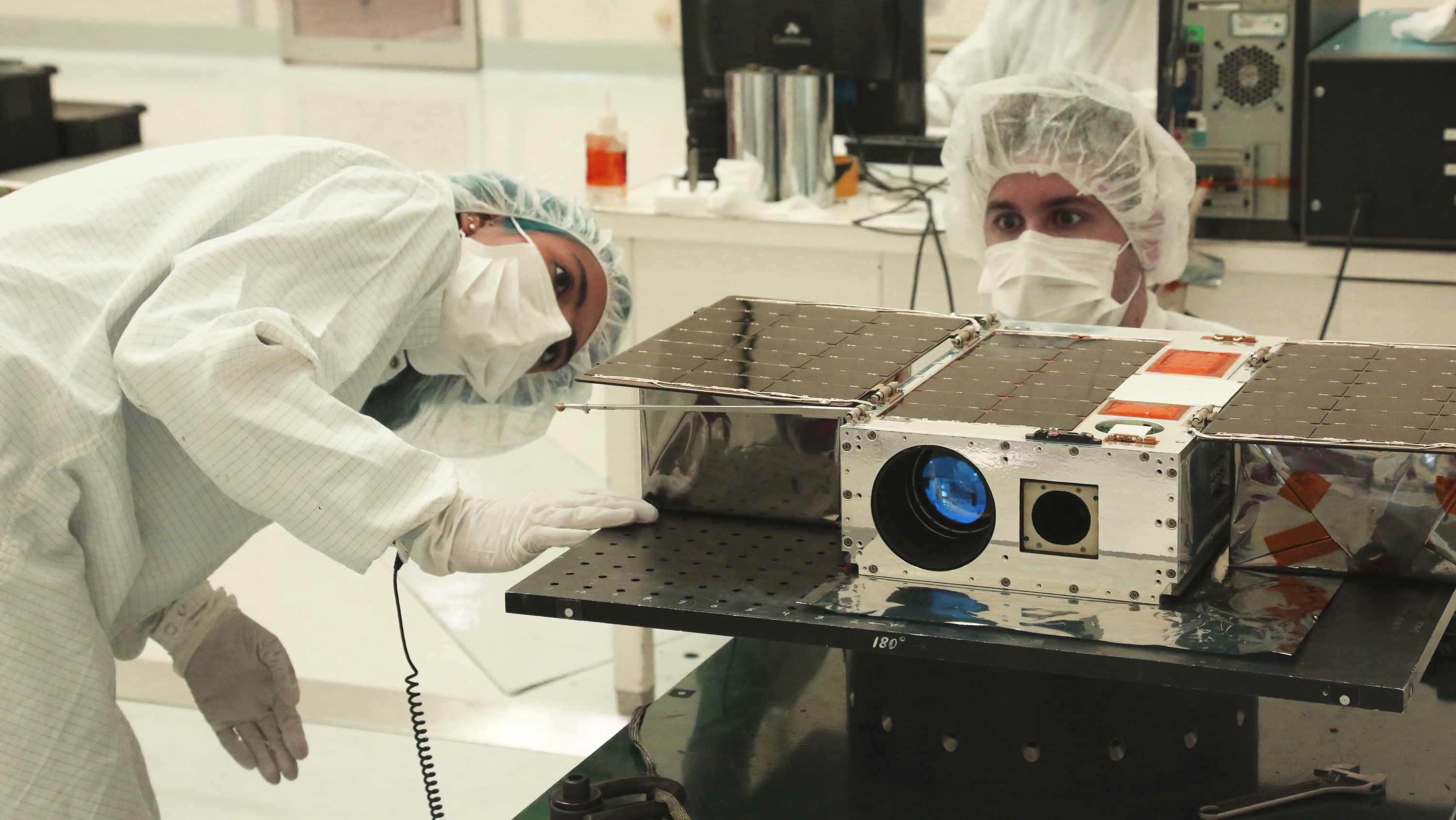 Engineers with the ASTERIA satellite.