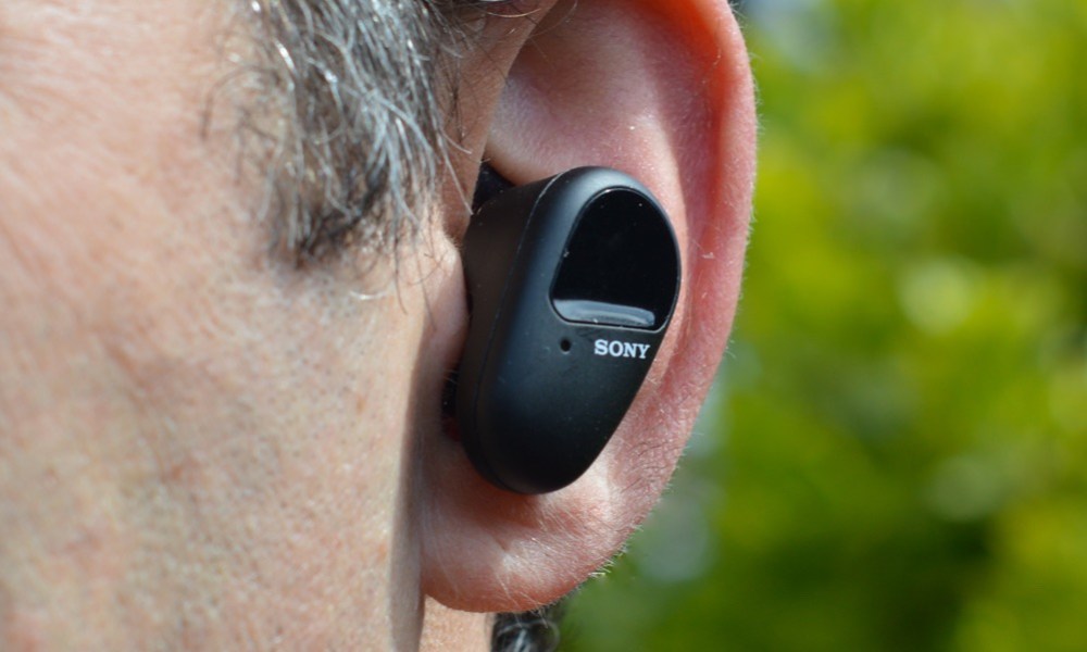 The Sony WF-SP800N earbud in an ear.