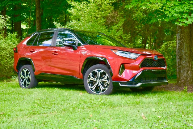 A 2021 Toyota RAV4 Prime in a park-like setting.