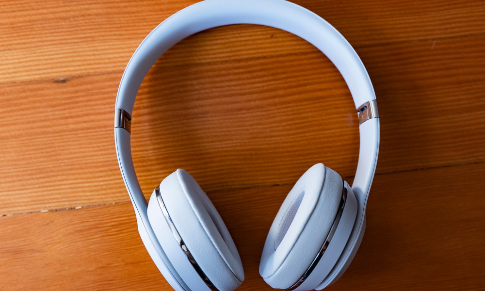 The Beats Solo3 wireless headphones on top of a table.