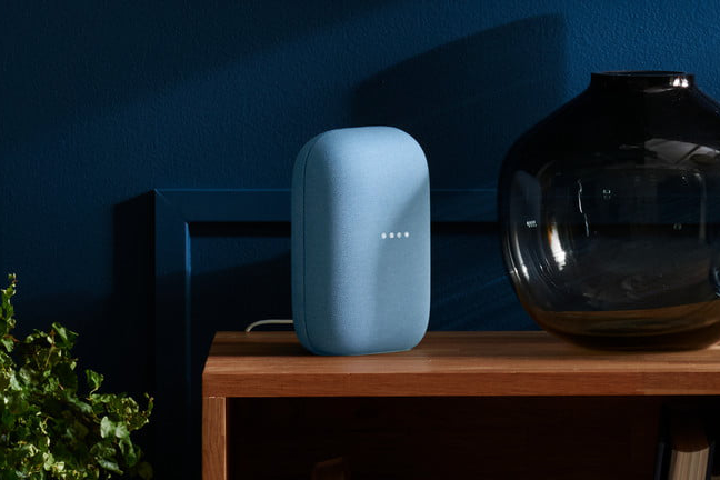 The Google Nest Audio speaker on a table.