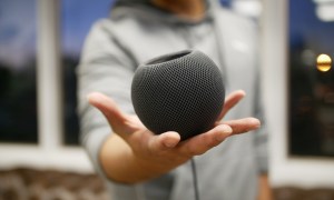 Apple HomePod mini in hand