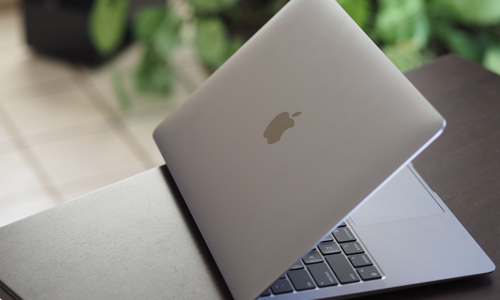 An opened Macbook Air M1 sitting on a table.