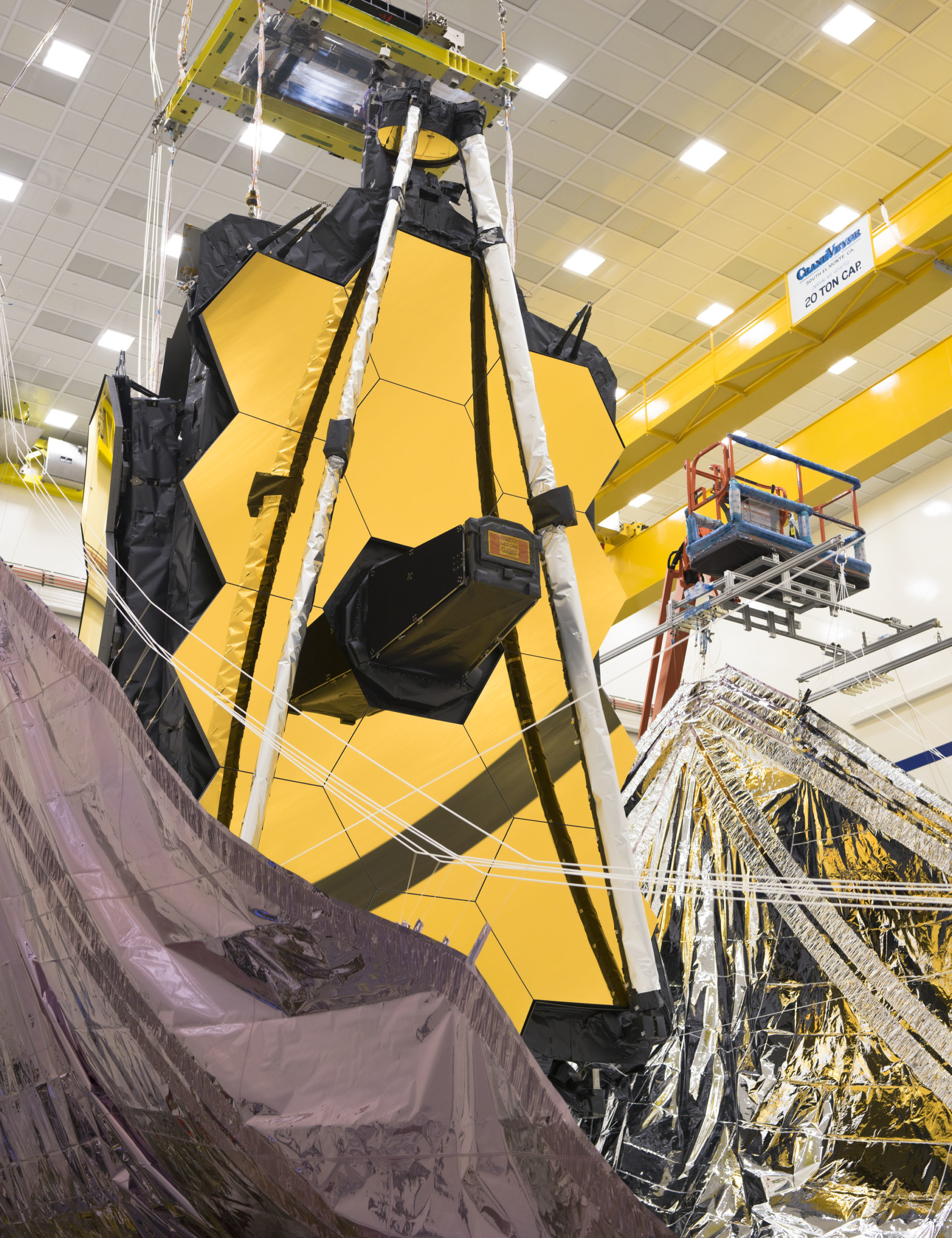 Both sides of the James Webb Space Telescope's sunshield were lifted vertically in preparation for the folding of the sunshield layers.