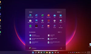 The new centered Windows 10 Start Menu with a red and black background