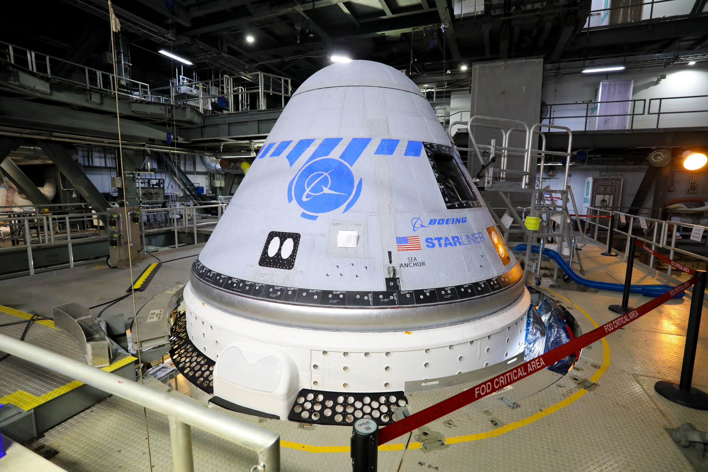Boeing’s CST-100 Starliner spacecraft in the United Launch Alliance Vertical Integration Facility at Space Launch Complex 41.