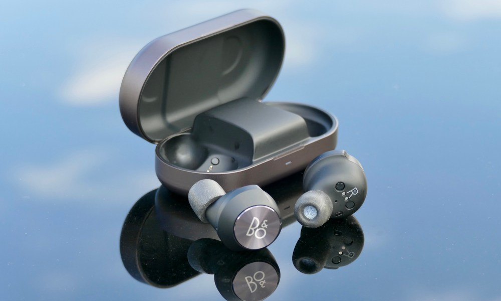 The Beoplay EQ case open with both earbuds removed.