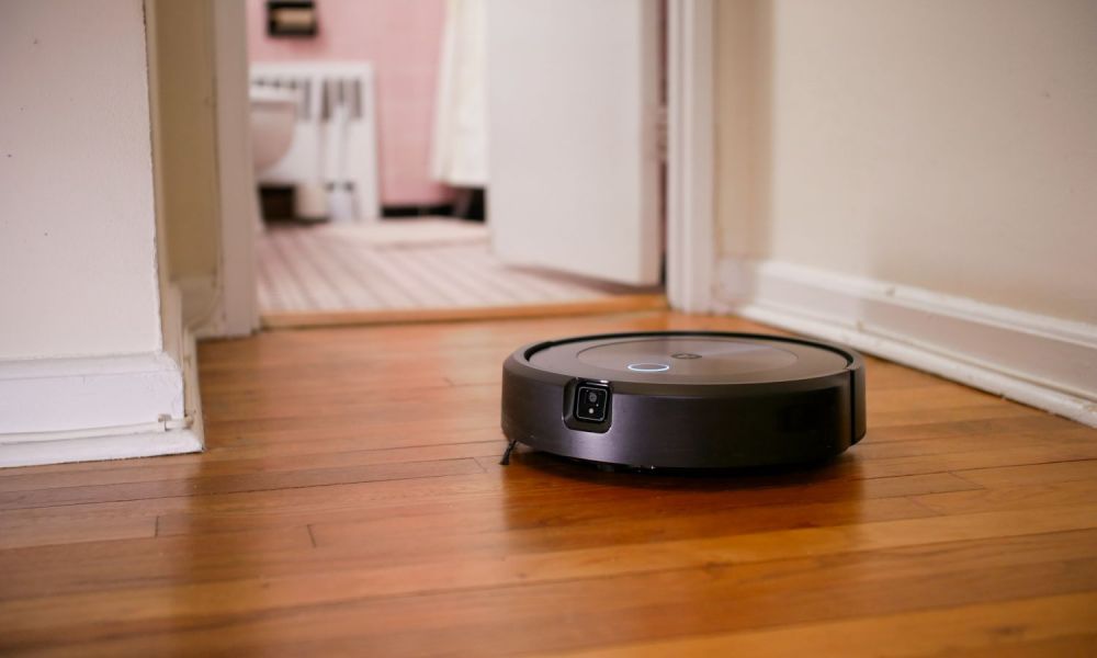 iRobot Roomba j7+ on hardwood floor.