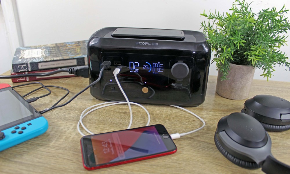 EcoFlow RIVER Mini charging devices on a desk.