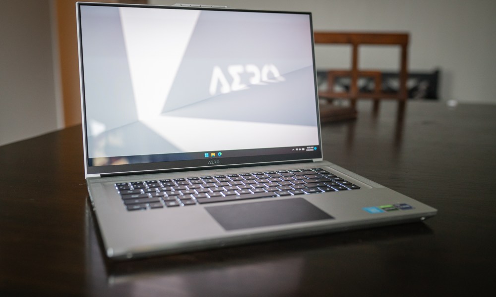 Gigabyte Aero 16 laptop sitting on a table.