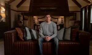 Nathan sitting by himself in his room at Lakeview in the Amazon Prime series Upload.