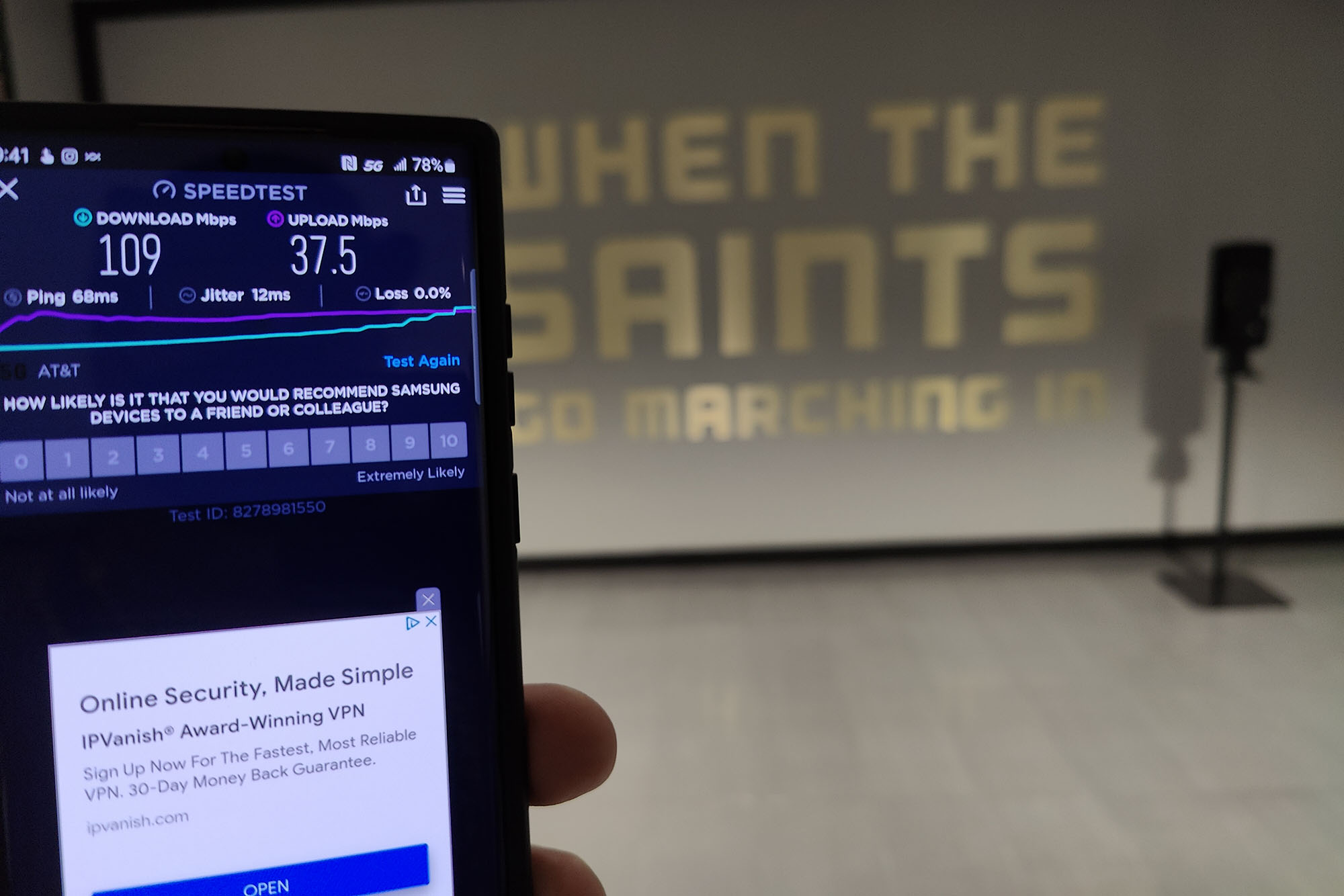 5G test with the Saints logo in the background.