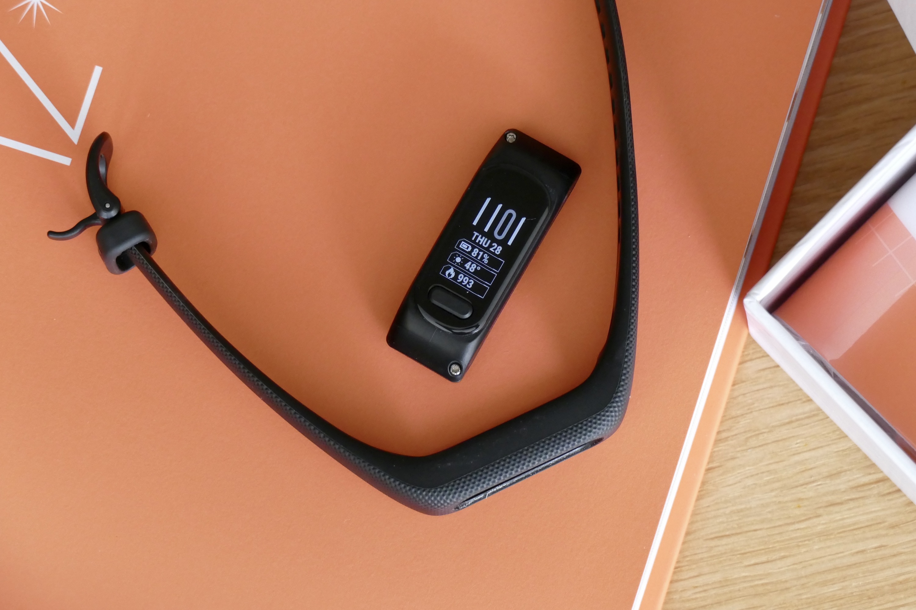 The Garmin Vivosmart 5's module removed from the strap.