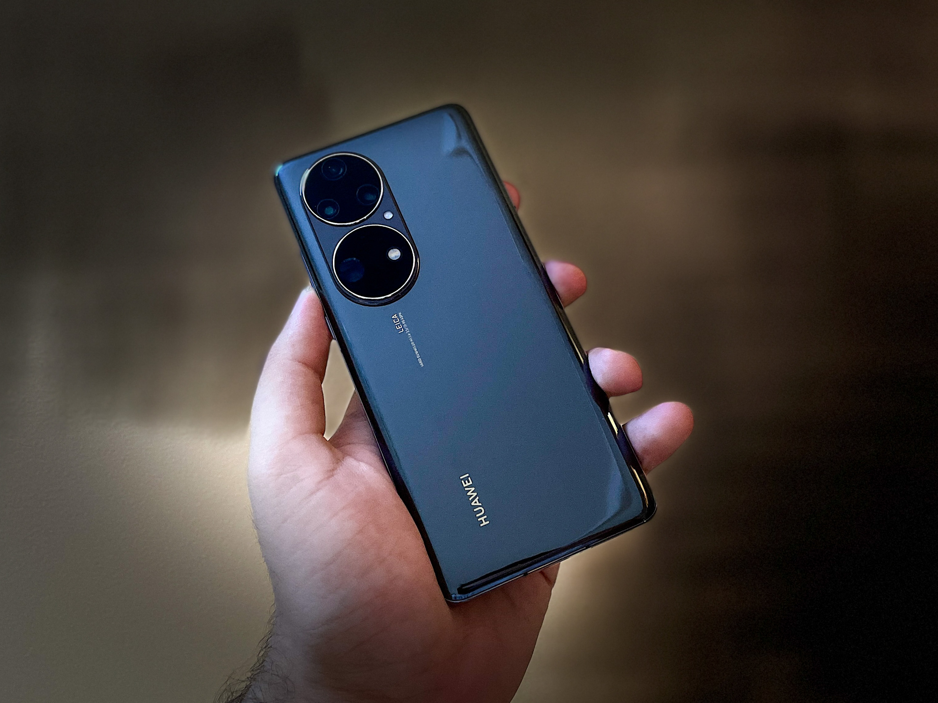 Huawei P50 Pro back panel in hands.