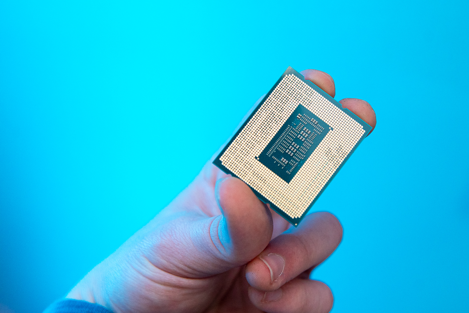 Someone holding the Core i9-12900KS processor.