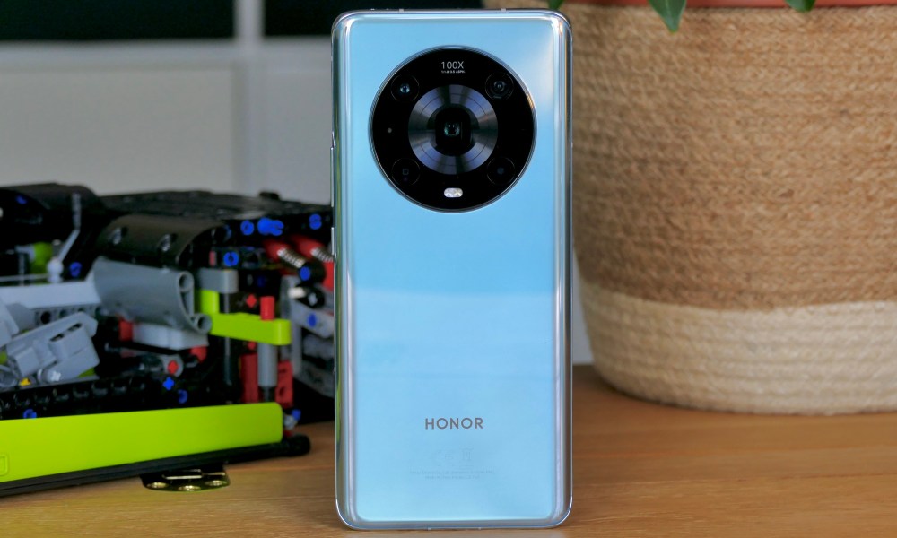 Honor Magic4 Pro seen from the back, in its cyan color.