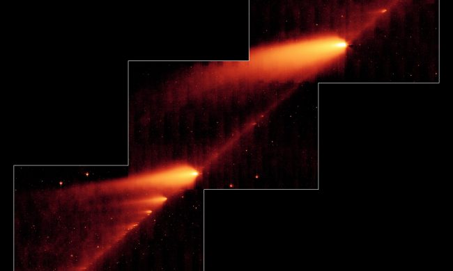 This infrared image from NASA’s Spitzer Space Telescope shows the broken Comet 73P/Schwassman-Wachmann 3 skimming along a trail of debris left during its multiple trips around the sun. The flame-like objects are the comet’s fragments and their tails, while the dusty comet trail is the line bridging the fragments.