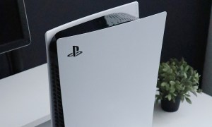 The Playstation 5 system standing upright.