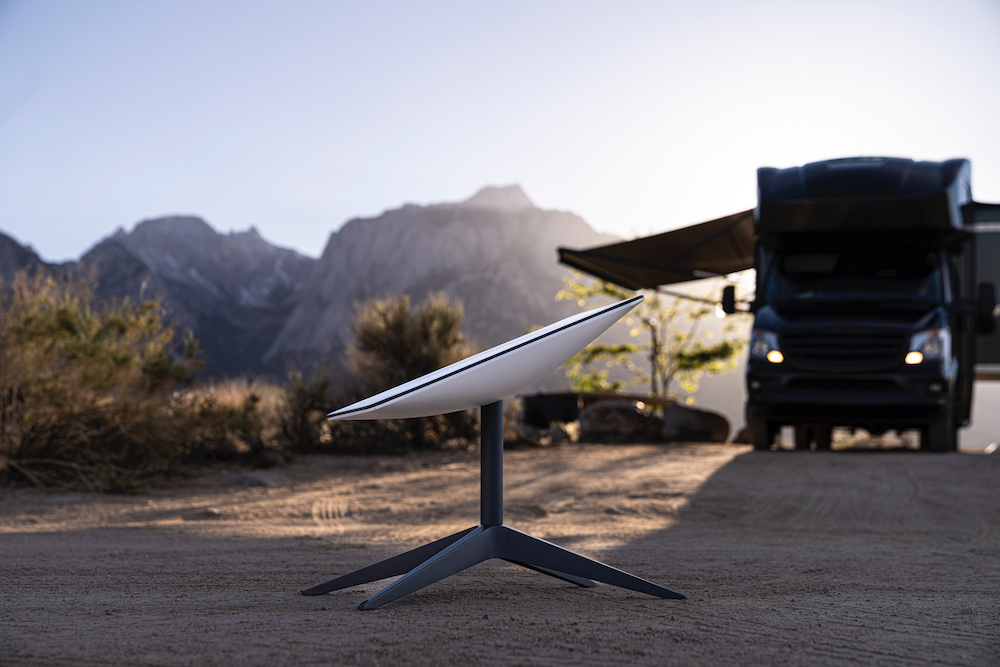 A Starlink dish next to an RV.