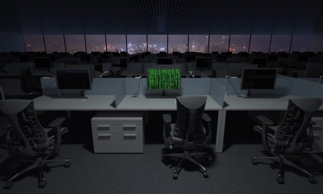 A depiction of a hacked computer sitting in an office full of PCs.