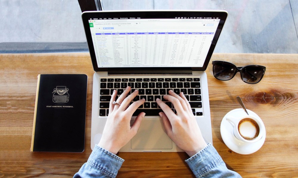 Spreadsheet on a laptop on a table.