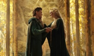 Galadriel strokes the face of a man in The Rings of Power.