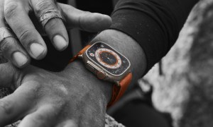 Someone wearing the Apple Watch Ultra while climbing.