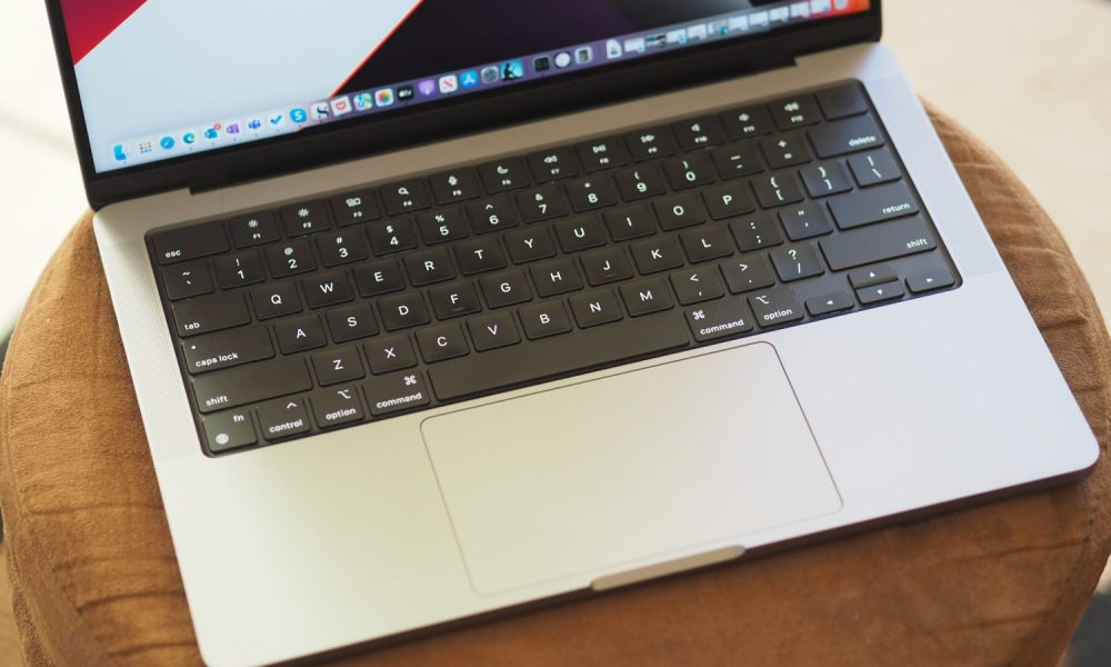 Apple MacBook Pro 14 top down view showing keyboard and touchpad.