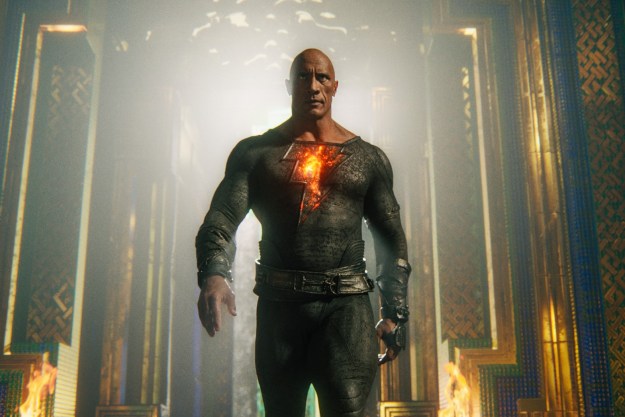 Dwayne Johnson strides toward the camera as Black Adam.