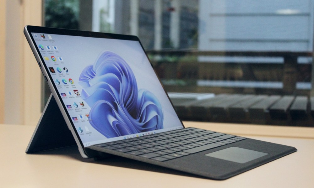 The Surface Pro 9 with the Type Cover keyboard lifted up.